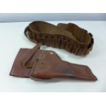 A BROWN LEATHER HOLSTER MARKED BUFFALO AND A CARTRIDGE BELT (2)