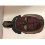 AN ANTIQUE AFRICAN HUNTING TRIBAL MASK LENGTH 46 CM