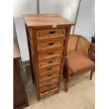 A MODERN HARDWOOD FRAMED CHEST OF NINE WICKER DRAWERS, 17.5" WIDE