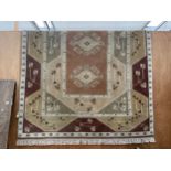 A LARGE BROWN PATTERNED RUG