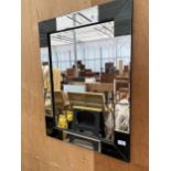 A DECORATIVE FRAMED MIRROR