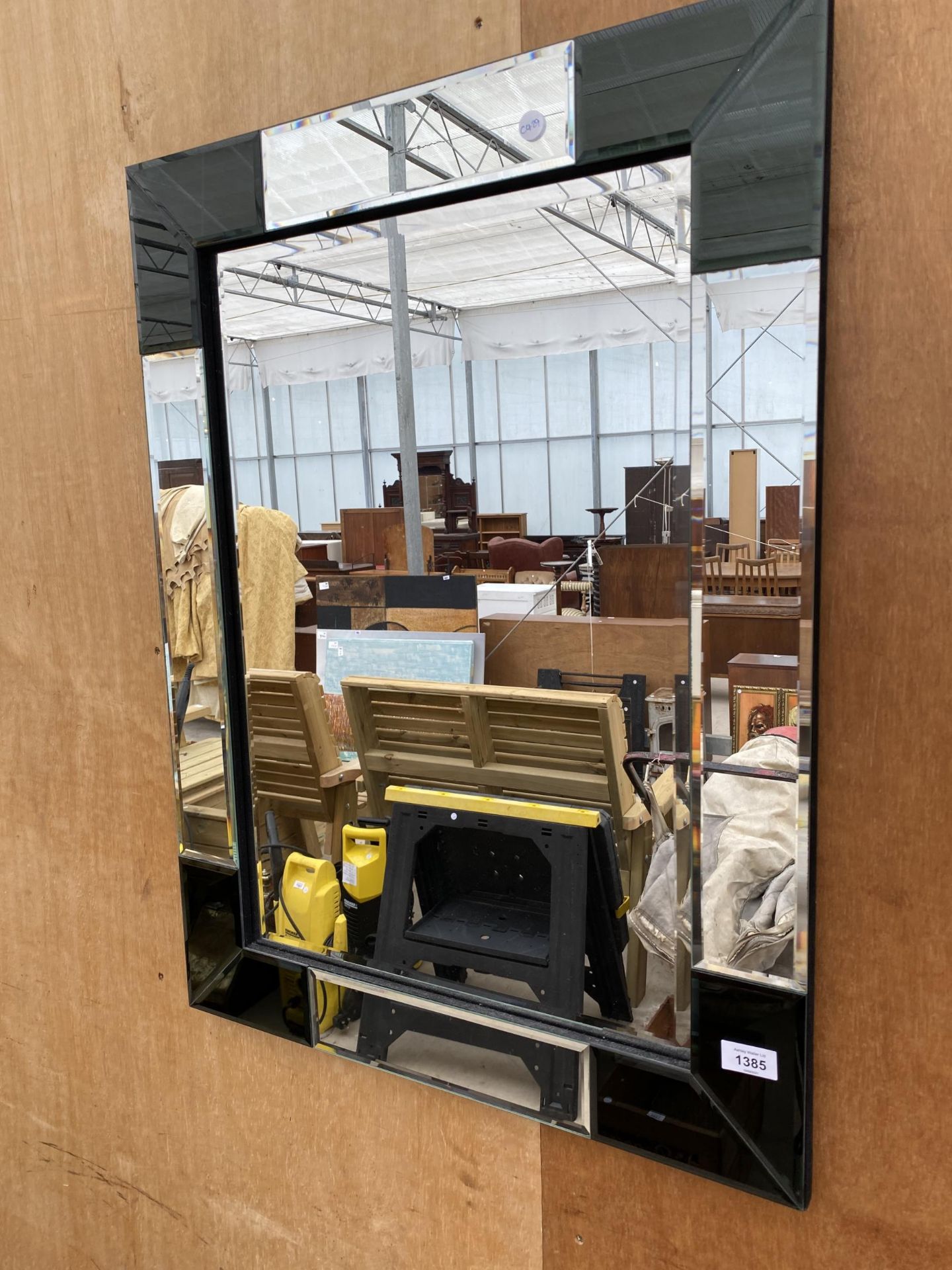 A DECORATIVE FRAMED MIRROR