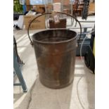 A VINTAGE GALVANISED BUCKET WITH A SWING HANDLE