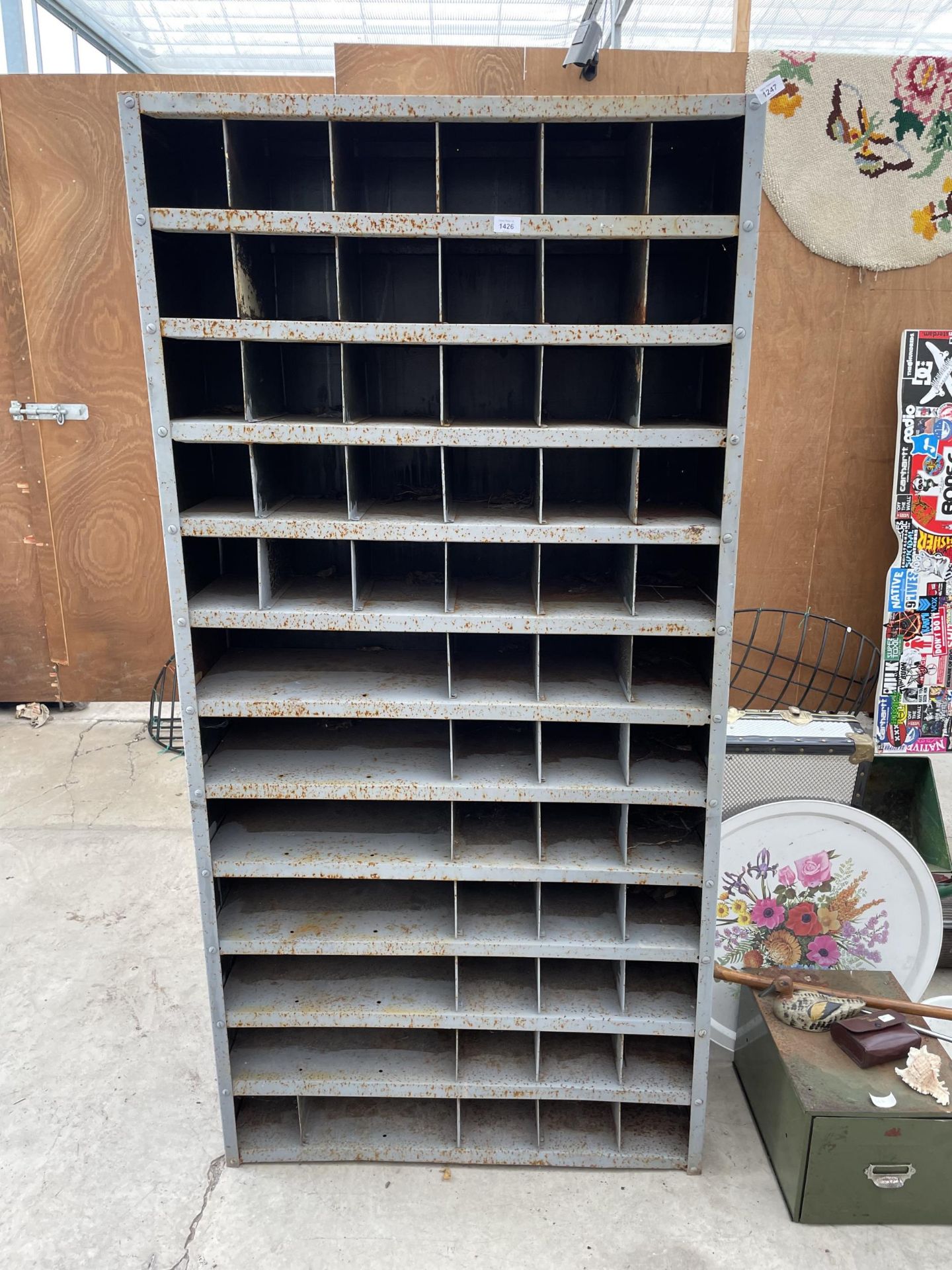 A VINTAGE METAL 60 SECTION PIGEON HOLE STORAGE UNIT