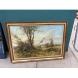 A LARGE GILT FRAMED PRINT ON CANVAS