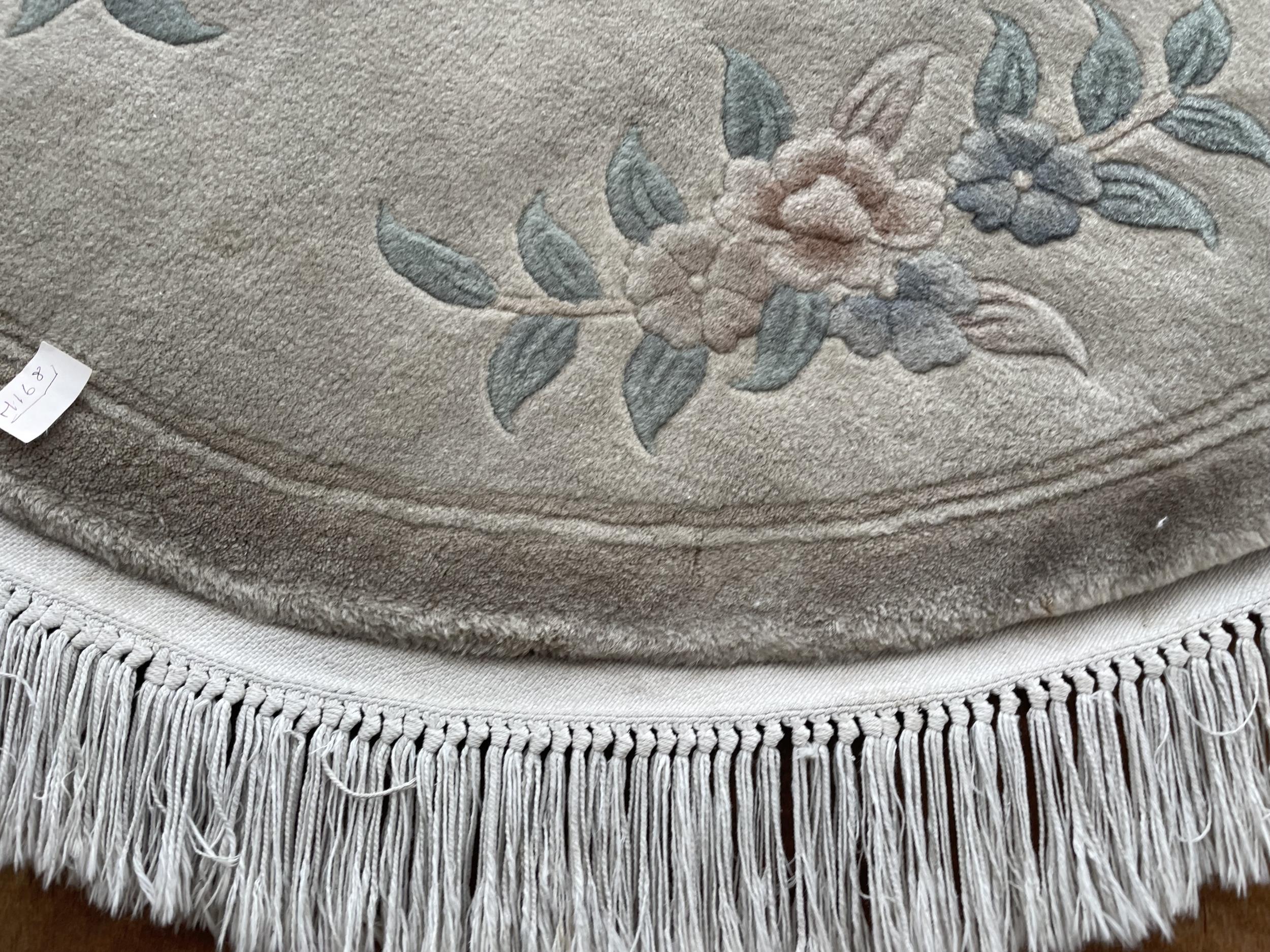 AN OVAL CREAM PATTERENED FRINGED RUG - Image 2 of 2