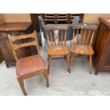 A PAIR OF PINE VICTORIAN STYLE KITCHEN CHAIRS AND SINGLE DITTO