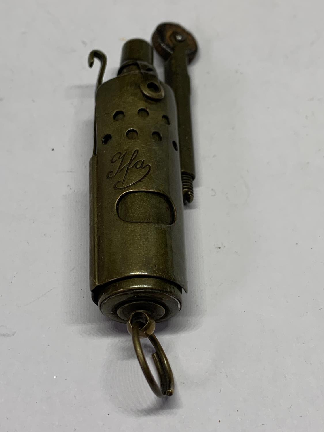 A BRASS GERMAN TRENCH ART CIGARETTE LIGHTER