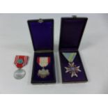 TWO CASED JAPANESE MEDALS COMPRISING SACRED TREASURE AND ORDER OF THE RISING SUN, AND A JAPANESE RED