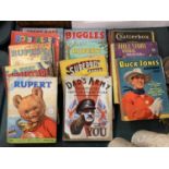 A COLLECTION OF VINTAGE ANNUALS TO INCLUDE RUPERT, SUPERBOY, BUCK JONES , BIGGLES ETC