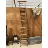 A VINTAGE TWELVE RUNG LADDER