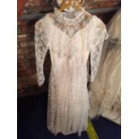 A VINTAGE LACE WEDDING DRESS WITH TWO VEILS