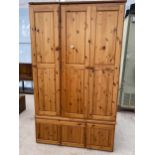 A MODERN PINE TRIPLE WARDROBE 54" WIDE