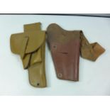 A U.S. BROWN LEATHER SHOULDER HOLSTER AND A LEATHER HOLSTER WITH MAGAZINE COMPARTMENTS (2)