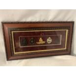 A FRAMED SET OF MILITARY BADGES