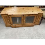 A DUCAL PINE BREAKFRONT ENTERTAINMENT UNIT, 53" WIDE