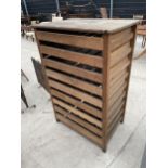 A VINTAGE PINE APPLE STORAGE CABINET WITH PULL OUT CRATE DRAWERS