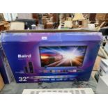A BAIRD 32" TELEVISION WITHE STAND AND REMOTE CONTROL