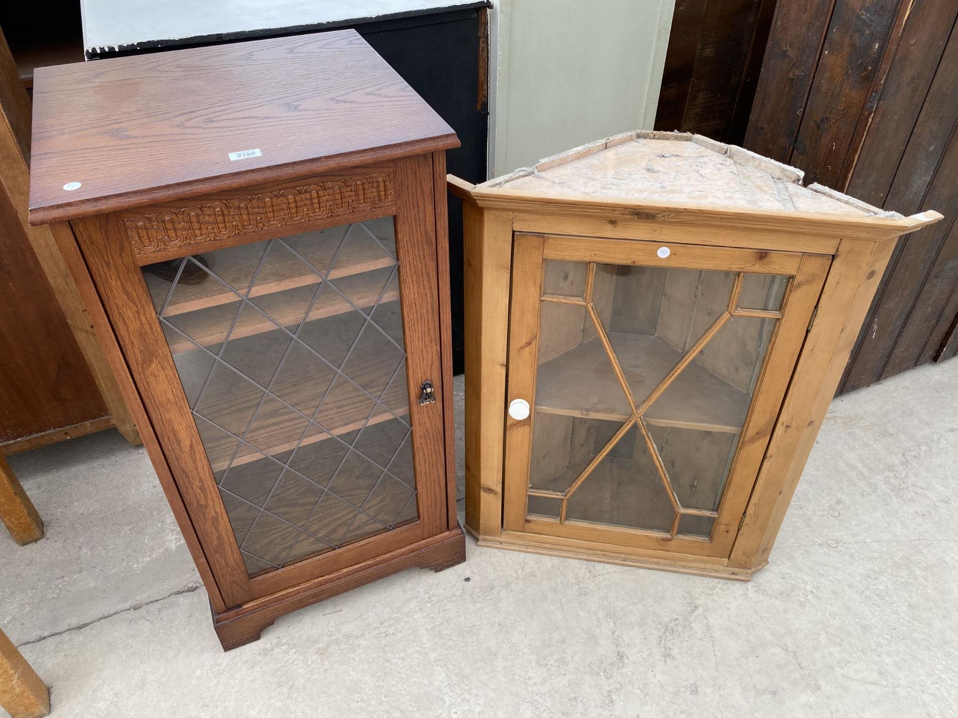 A PINE ASTRAGAL GLAZED CORNER CUPBOARD AND AN OAK STEREO CABINET