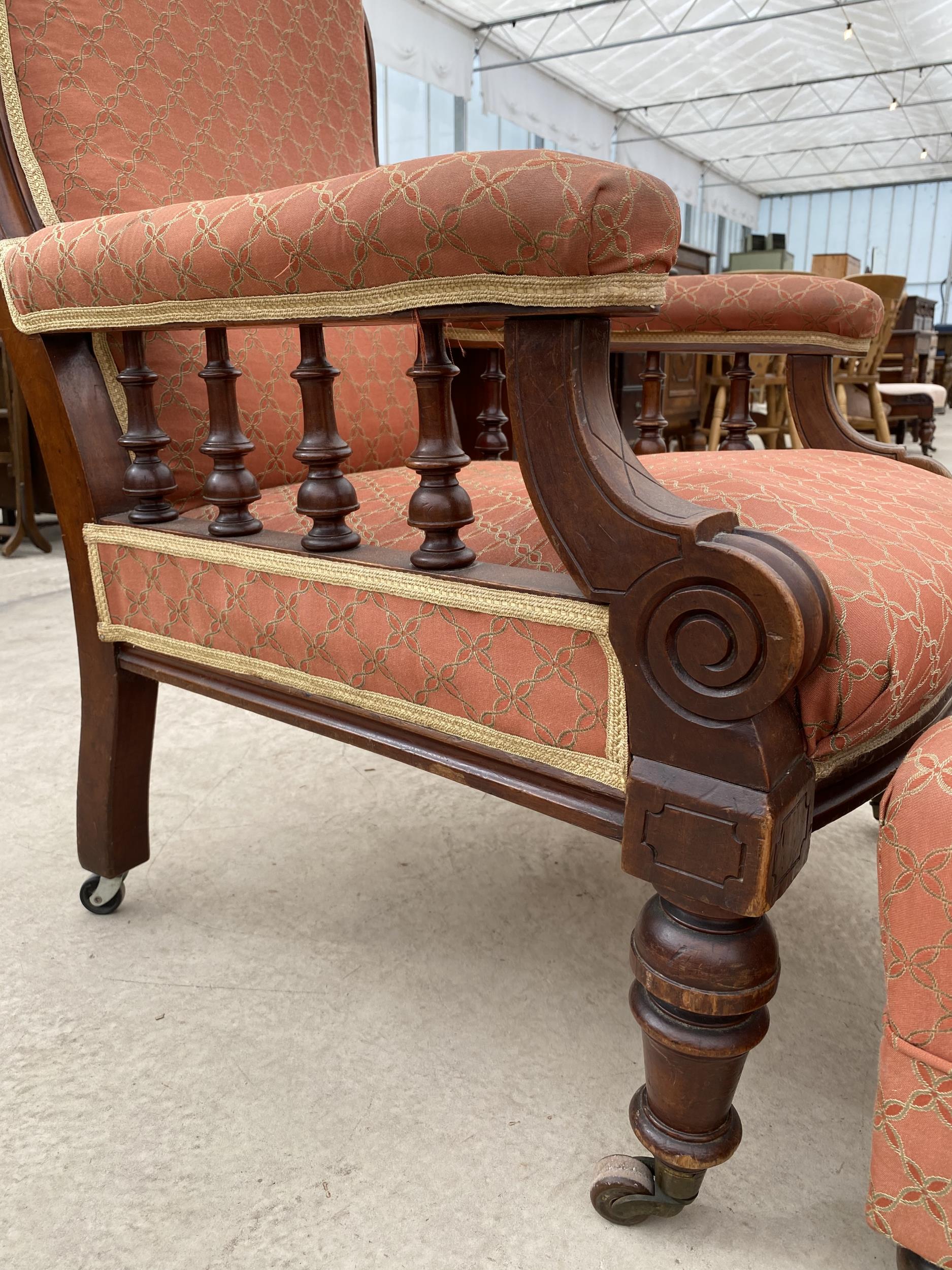A VICTORIAN MAHOGANY FIRESIDE CHAIR WITH TURNED UPRIGHTS AND FRONT LEGS WITH LATER STOOL HAVING - Image 5 of 6