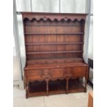 A GEORGE III STYLE DRESSER WITH SEVEN DRAWERS AND POT BOARD TO THE BASE, PLATE RACK WITH SIX