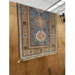 A KAZAX STYLE FRINGED PATTERNED RUG