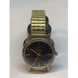 A YELLOW METAL NELSON WRISTWATCH SEEN WORKING BUT NO WARRANTY