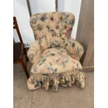 A MODERN BUTTON BACK BEDROOM CHAIR ON FRONT CABRIOLE LEGS