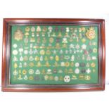 AN IMPRESSIVE FRAMED COLLECTION OF 125 BRITISH ARMY CAP BADGES TO INCLUDE ROYAL ARTILLERY,