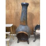 A DECORATIVE CAST IRON GARDEN CHIMENEA