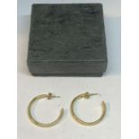 A PAIR OF LARGE 9 CARAT GOLD HOOP EARRINGS IN A PRESENTATION BOX