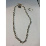 A SILVER NECKLACE WITH HEART PENDANT 16 INCHES LONG