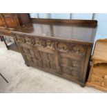 AN EARLY 20TH CENTURY OAK JACOBEAN STYLE SIDEBOARD, 53" WIDE