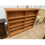 A MODERN TWO DIVISION OPEN PINE BOOK CASE WITH TEN SHELVES, 56" WIDE