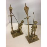 TWO BRASS FIGURES OF STREETLAMP LIGHTERS WITH DOGS