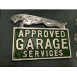 A CHROME JAGUAR GARAGE SERVICES SIGN