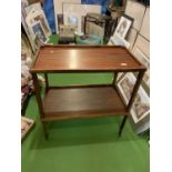 A WOODEN TEA TROLLEY