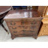 A MAHOGANY AND CROSSBANDED CHIPPENDALE STYLE CHEST OF FOUR GRADUATED DRAWERS WITH SLIDE 29.5" WIDE