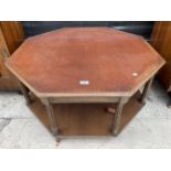 AN OCTAGONAL MAHOGANY AND CROSSBANDED COFFEE TABLE