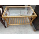 A BAMBOO COFFEE TABLE WITH GLASS TOP 31" X 19"
