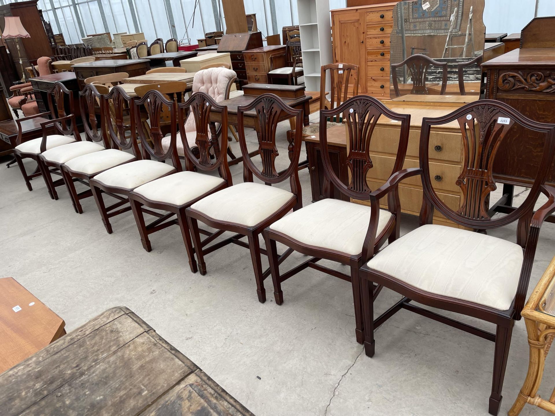A SET OF EIGHT HEPPLEWHITE STYLE DINING CHAIRS, TWO BEING CARVED