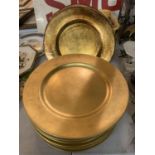 EIGHT GOLD COLOURED PLATE SETTING PLATES AND TWO LARGER BRONZE COLOURED SETTING PLATES