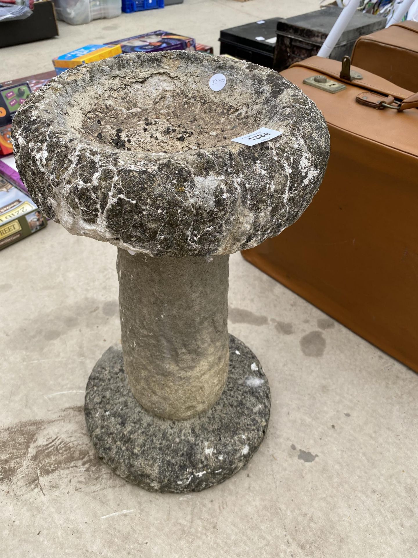 A STONE EFFECT GARDEN BIRD BATH