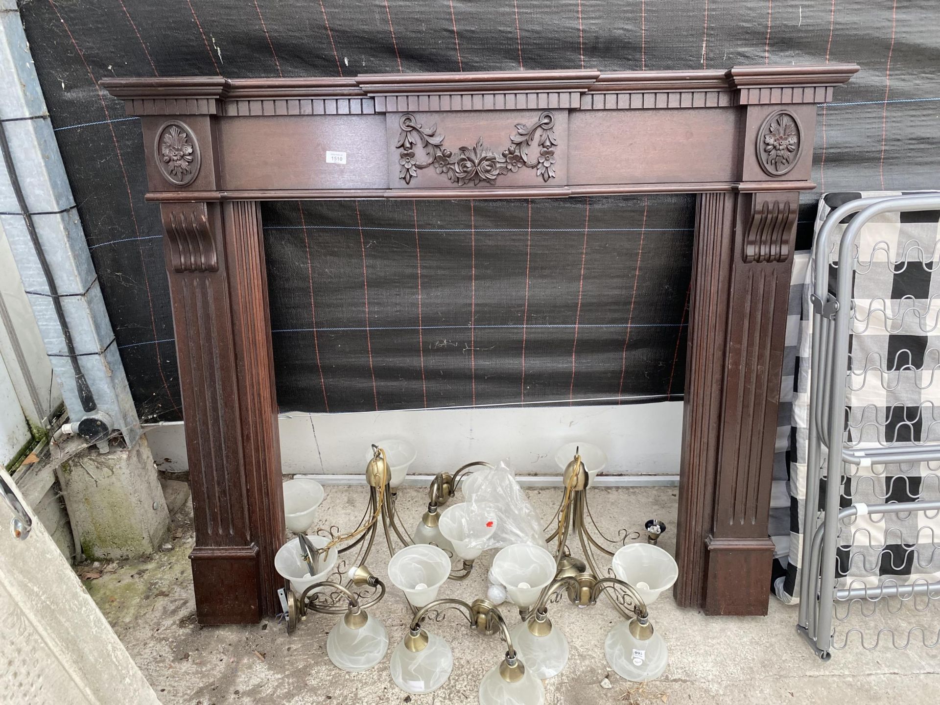 A WOODEN FIRE SURROUND AND AN ASSORTMENT OF LIGHT FITTINGS