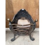 A VINTAGE AND DECORATIVE CAST IRON FIRE GRATE