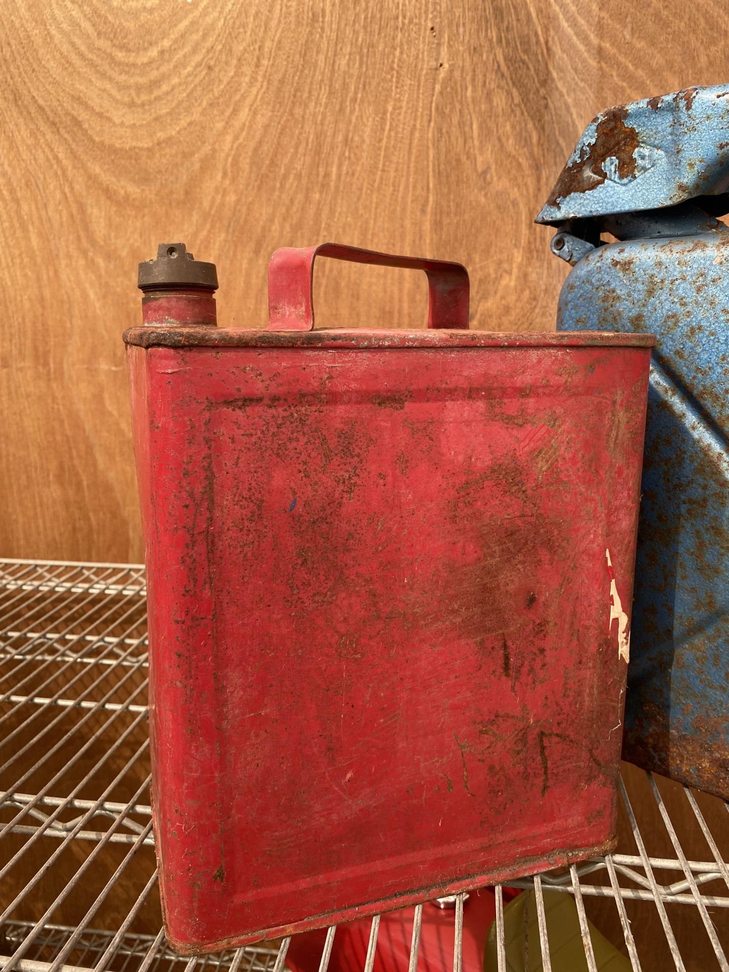 A VINTAGE RED FUEL CAN WITH BRASS TOP AND A FURTHER BLUE FUEL CAN - Image 2 of 4