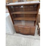 A SHINY WALNUT BOOKCASE WITH SLIDING GLASS DOORS