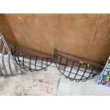 A PAIR OF WROUGHT IRON WALL HANGING HAY RACKS