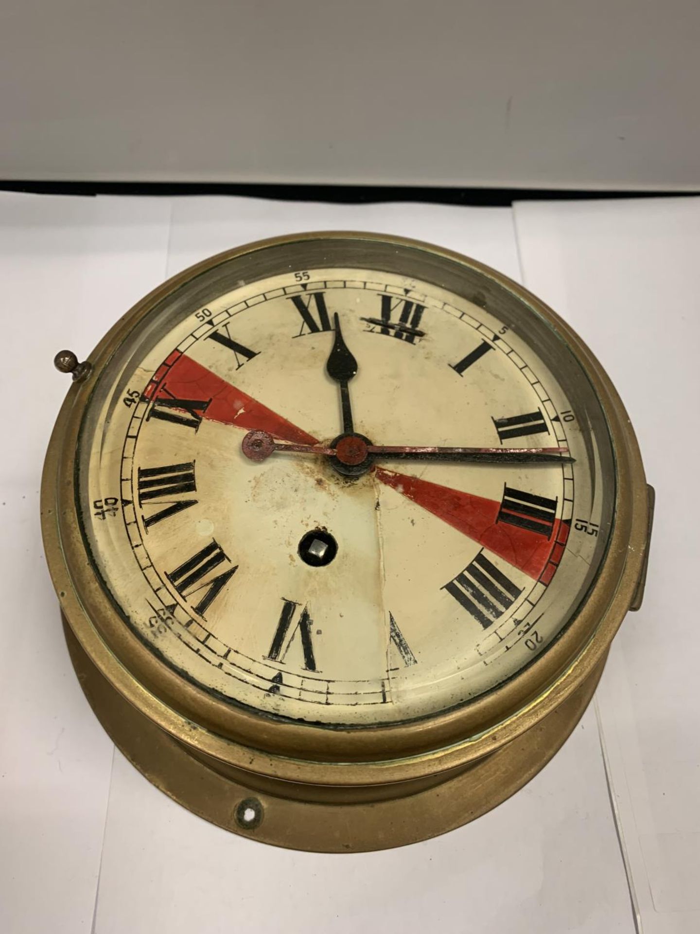 A BRASS SHIPS CLOCK