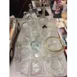 A COLLECTION OF GLASSWARE TO INCLUDE DECANTERS, DISHES ETC